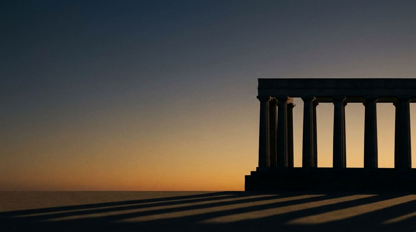Classical columned courthouse in silhouette at dusk